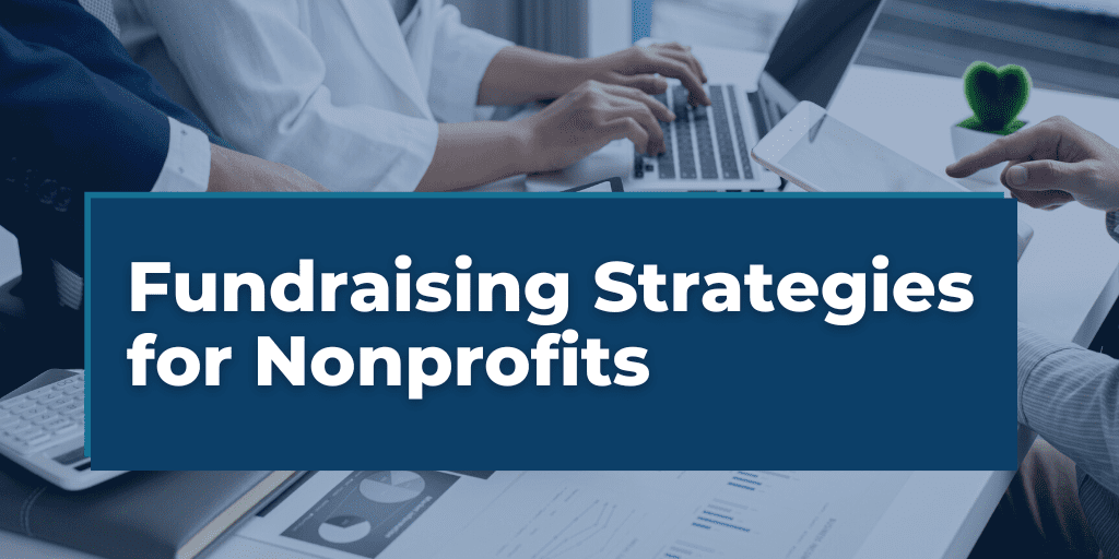 Fundraising Strategies for Nonprofits overlayed on a group of nonprofit executives discussing financial information